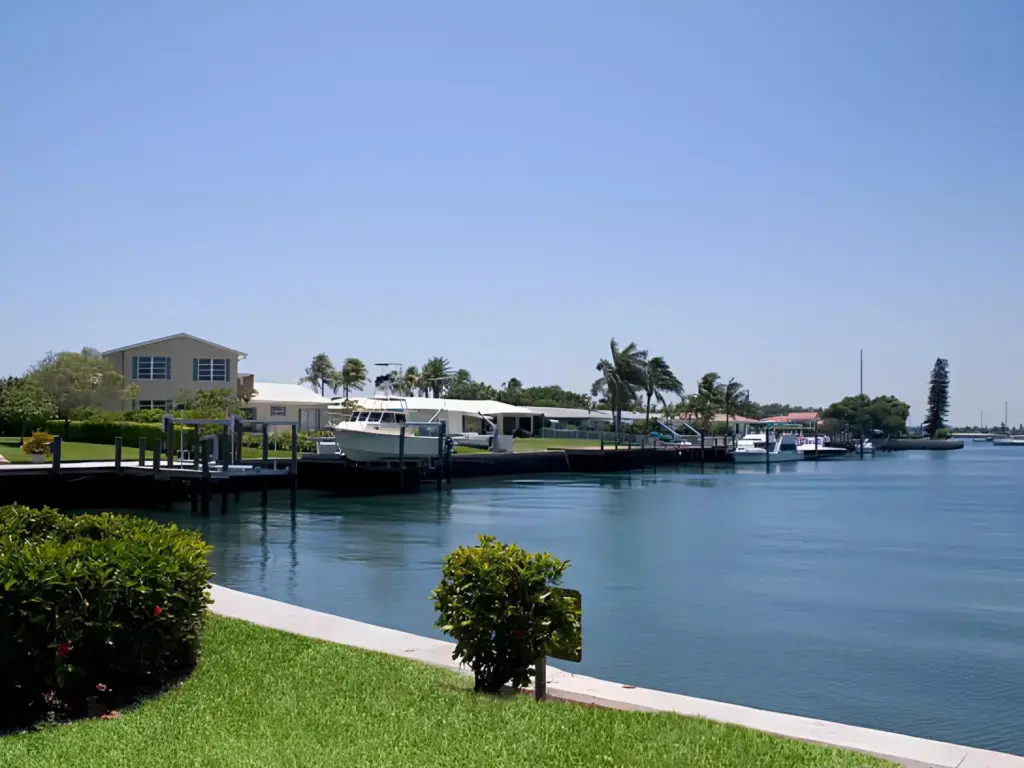 residential-seawall-with-docks-and-white-boats-featuring-sea-and-blue-sky-view-in-orlando-fl